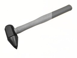 A carbide hammer point used for material removal
