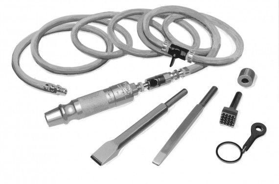 A pneumatic hose and two chisels with other attachments used for millstone dressing