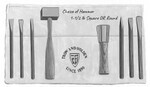 A collection of steel chisels and hammers used for carving soft stone