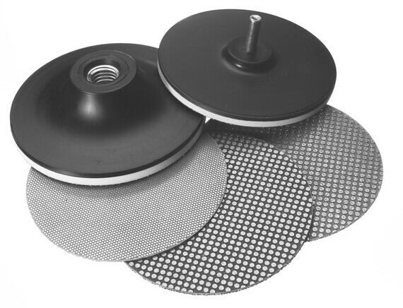 A set of two gray diamond pads and black backplates used for carbide tool maintenance