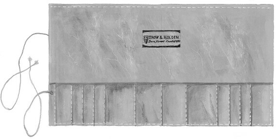 An open leather tool wrap with the trow and holden logo across the top