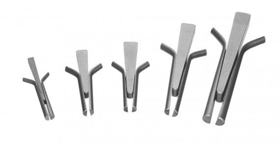 A wedge and shim set consisting of five wedges and shims of various sizes used for stone splitting