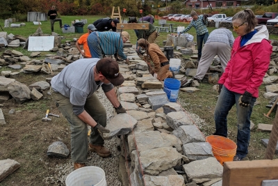 construction of instructional dry stone wall at Vermont Granite Museum