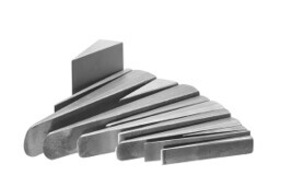 A set of steel hand splitting wedges used for stone splitting